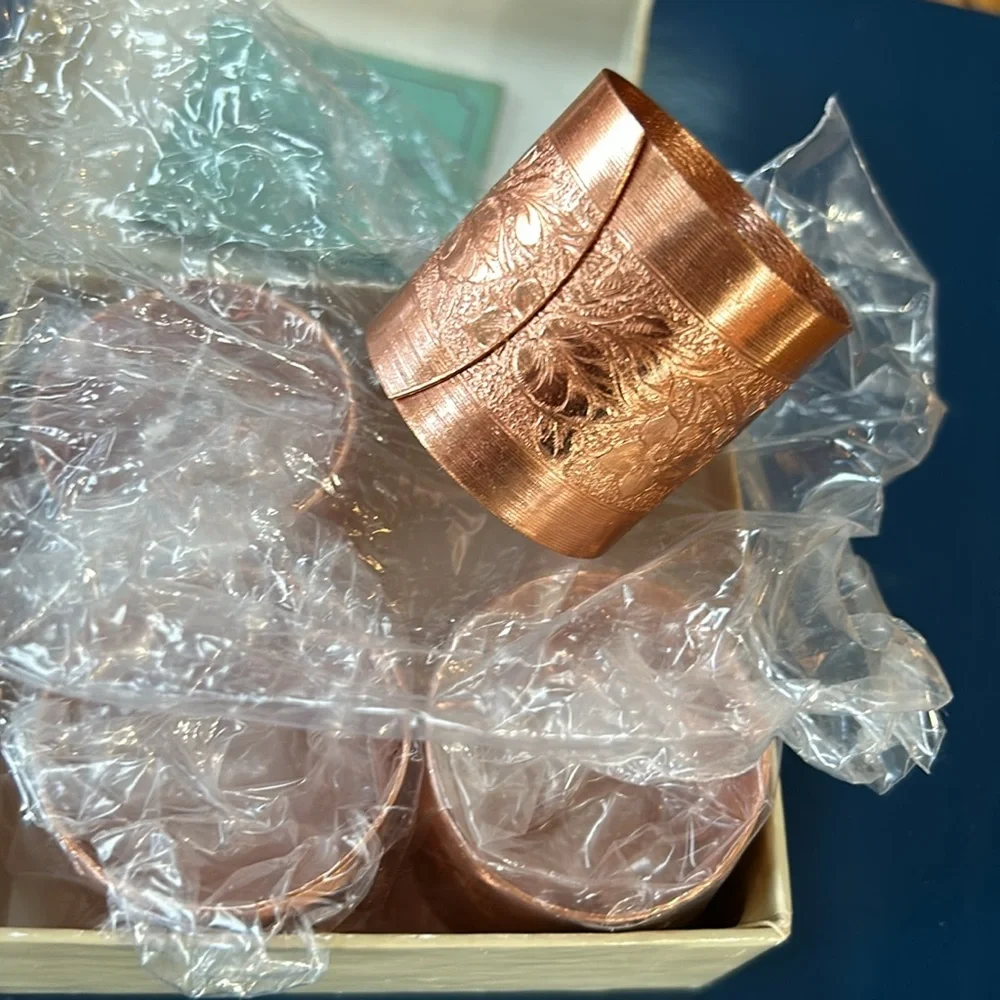 Vintage Coppercraft set of 4 copper napkin rings in box.